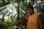 African pigmy hunter from the Baka tribe carying his broad blade spear in the deep jungles of Ca.jpg