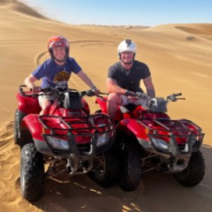 Quadbike Rides Coastal Area In Dunes Namibia