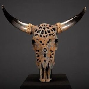 Carved Nguni Skull With oxidized Metal Powders