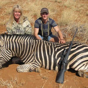 Wife and guide Brian with her zebra