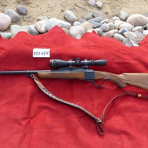 375 H&H Dakota Model 10 Rifle with Express sights, Leupold VX2 3x9x40 in Talley rings