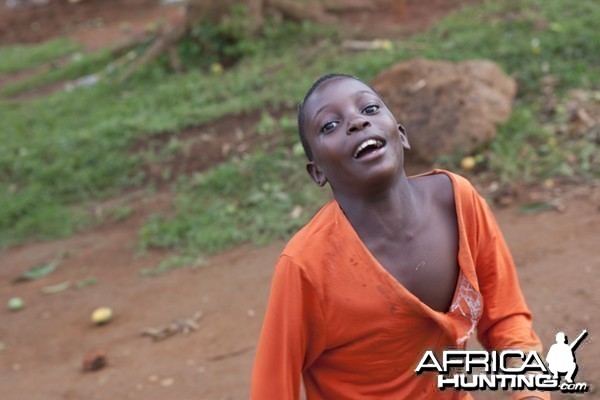 Bugala happy kid in orange, Uganda