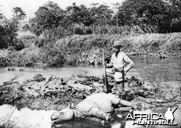 European hunter with a dead Javan Rhinoceros, Java Island 1895