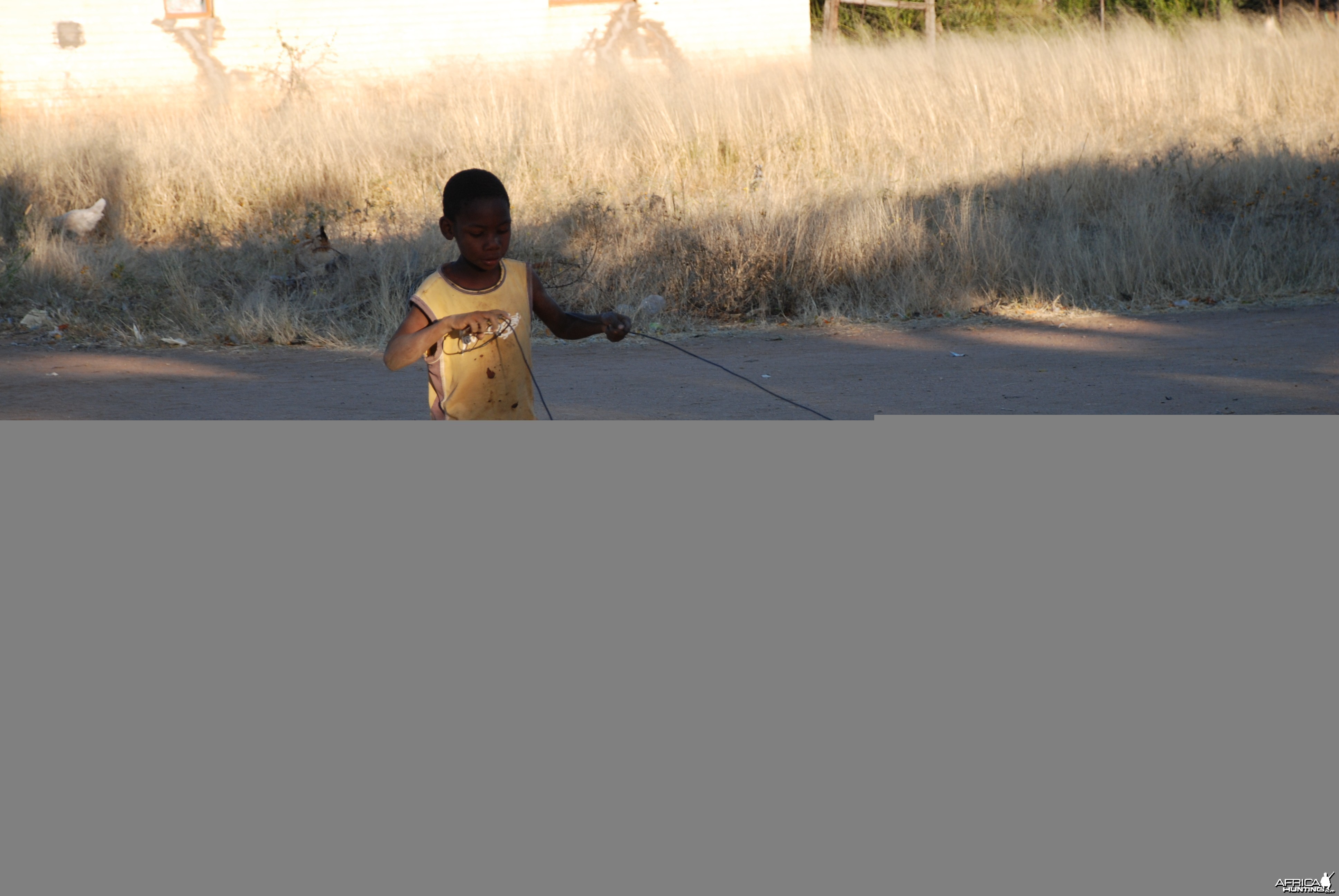 Boy playing with his car Namibia