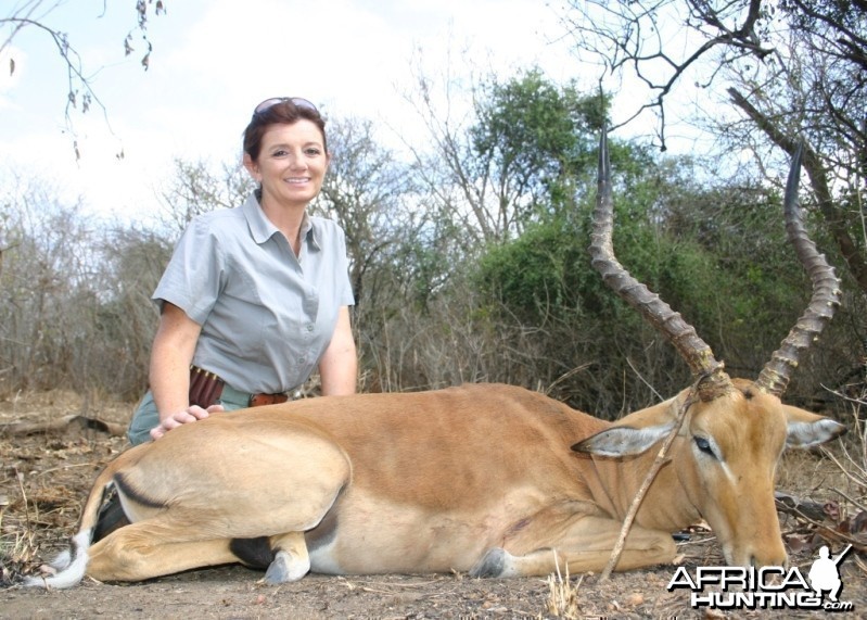 A very happy huntress with her first African kill
