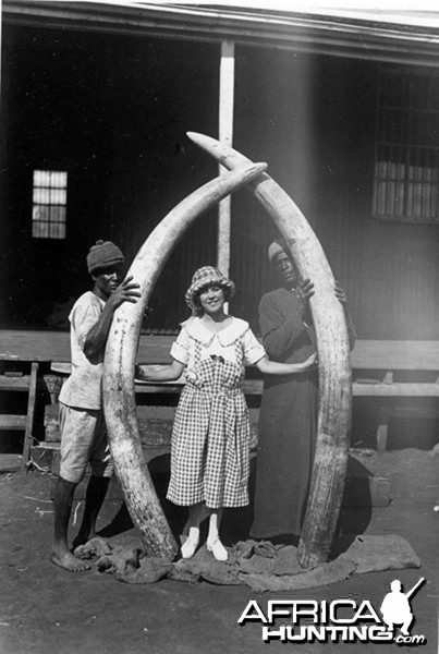 Osa Johnson holding 8 feet Elephant Tusks, circa 1920