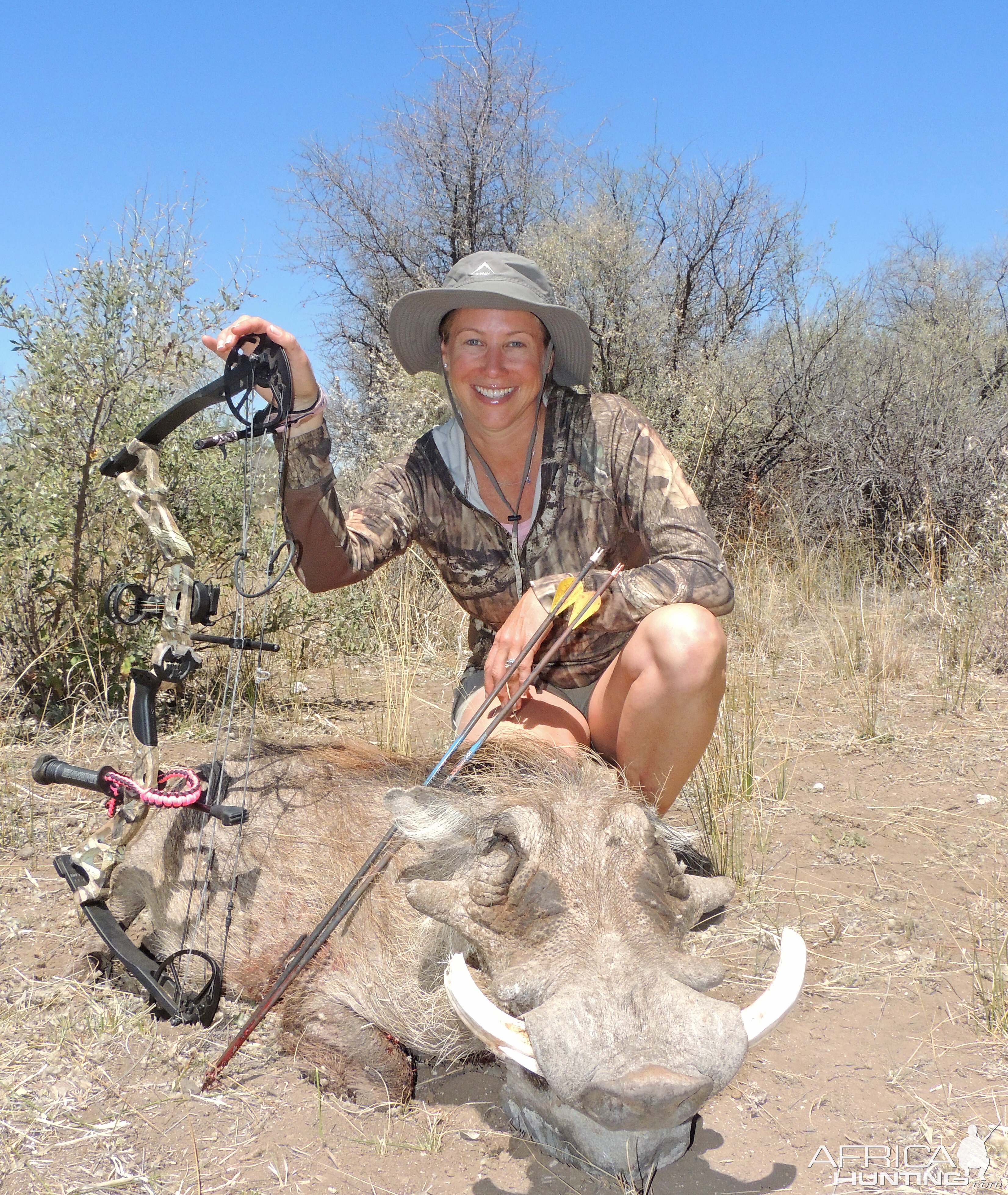 lady hunter and a fine warthog...