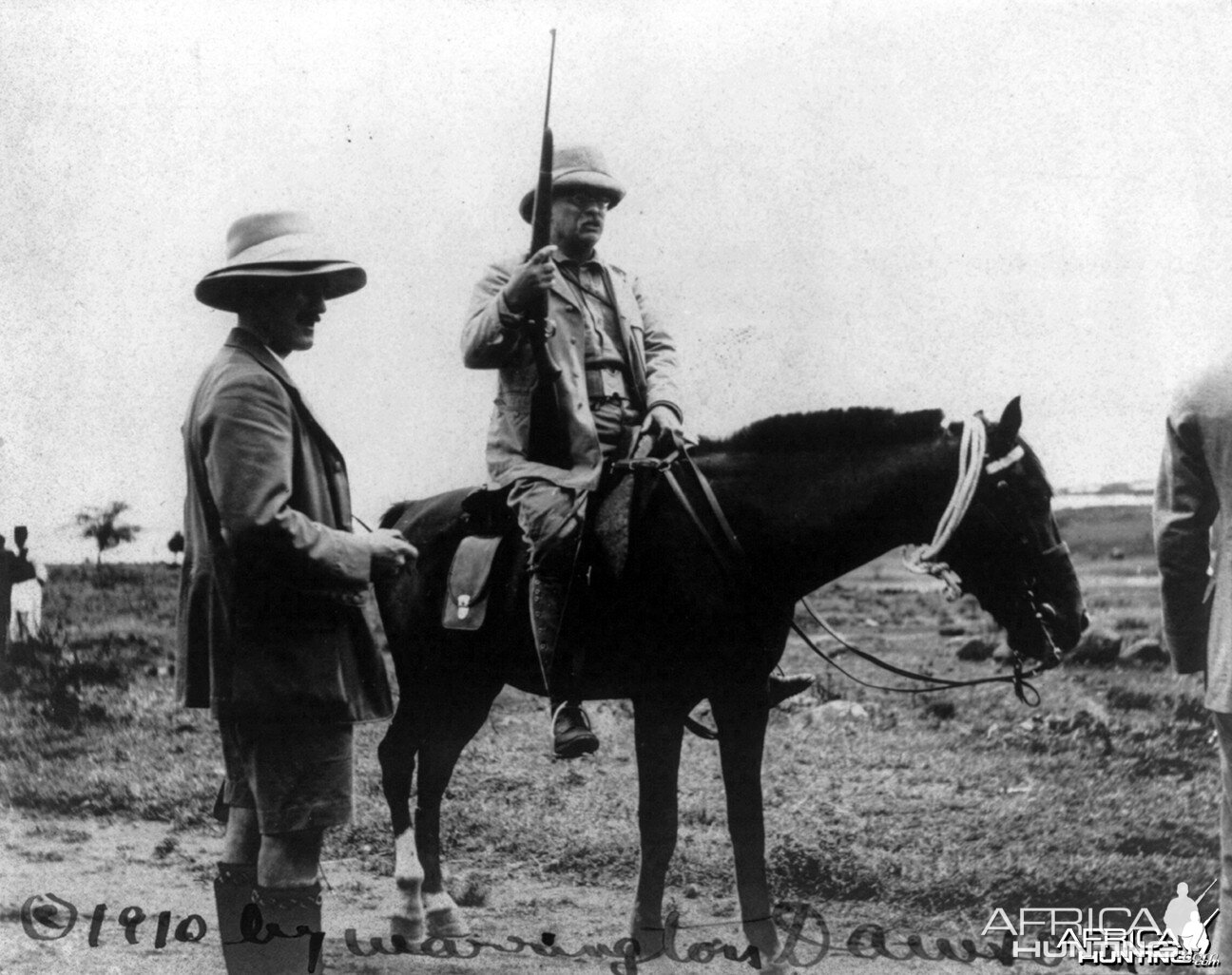 Theodore Roosevelt holding rifle on horseback in Africa, circa 1910