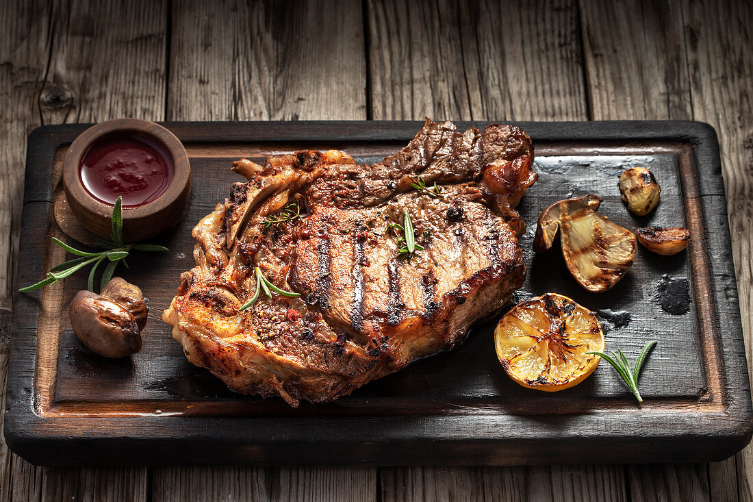 12568395-Grilled-T-bone-steak-on-a-serving-board.jpg