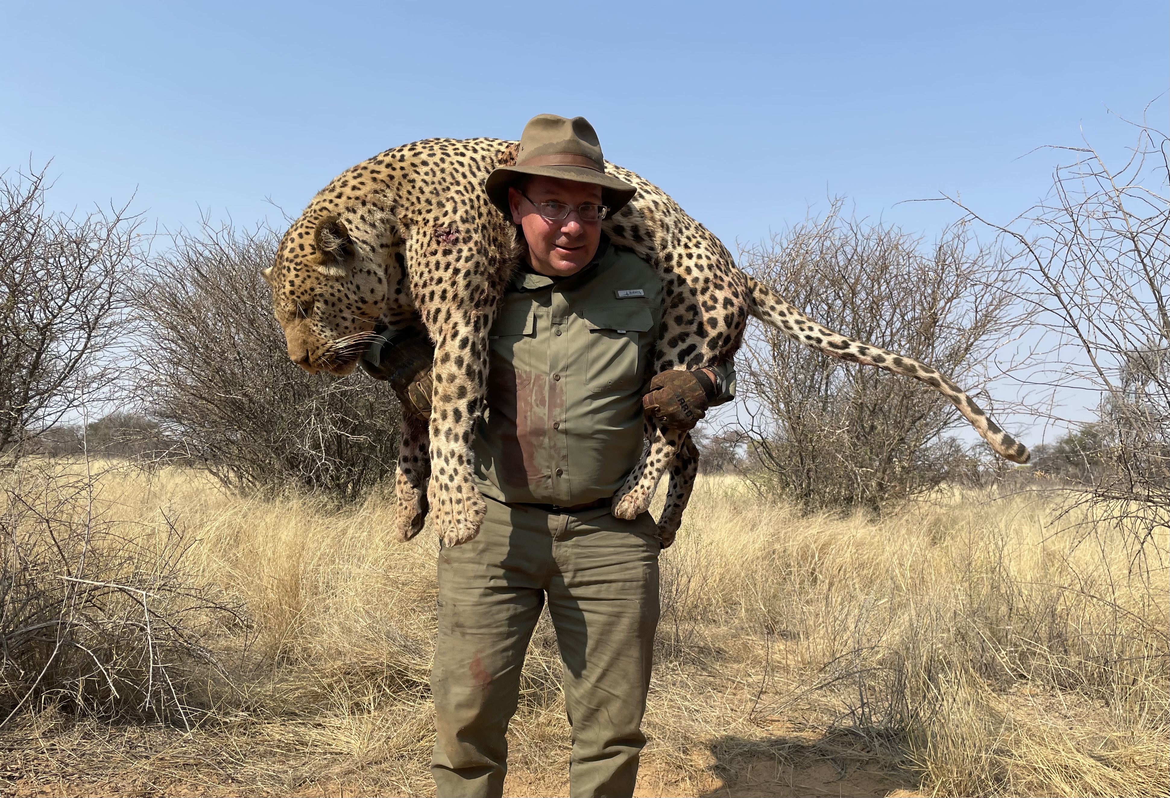 Tom with Leopard Carry 9.23 Botswana.jpg