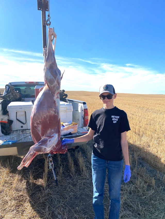 Trevin with antelope.jpeg