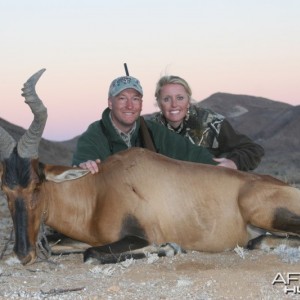My wife and I with a Red Hartebeest taken in Southern Namibia with Kum Kum