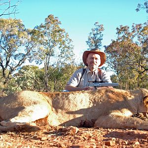 Lion with 500 S&W revolver, took with Warthog Safaris