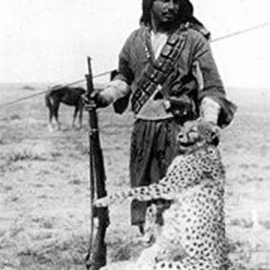 Bedouin hunter with a shot Asiatic Cheetah and cub, Iraq, 1925