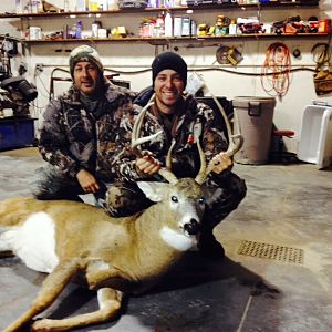 Proud papa with son's first big whitetail