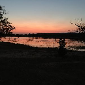 Sunrise over the reservoir at Hankano Ranch near the Gwayi River Zimbabwe
