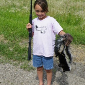 8 year old granddaughters first kill with her new .22, a skunk; PRICELESS