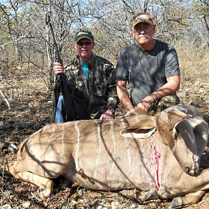 a friend and i with his kudu cow