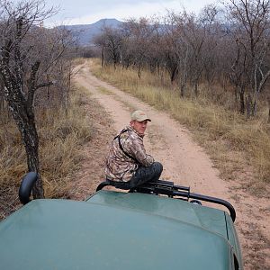 Dawie Kemp, sitting on the hunting truck