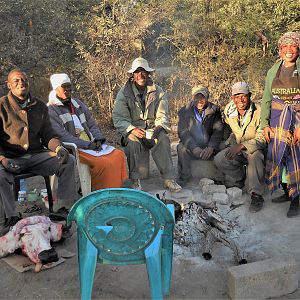 African Family having a Wildabeast head as a meal