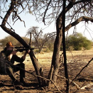 Aiming at a Warthog, Namibia