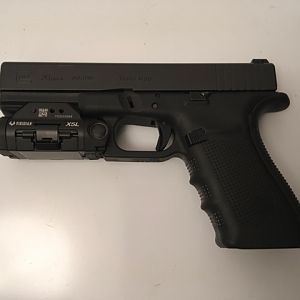 Glock G20 Handgun with Viridian light/laser