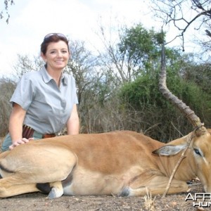 A very happy huntress with her first African kill