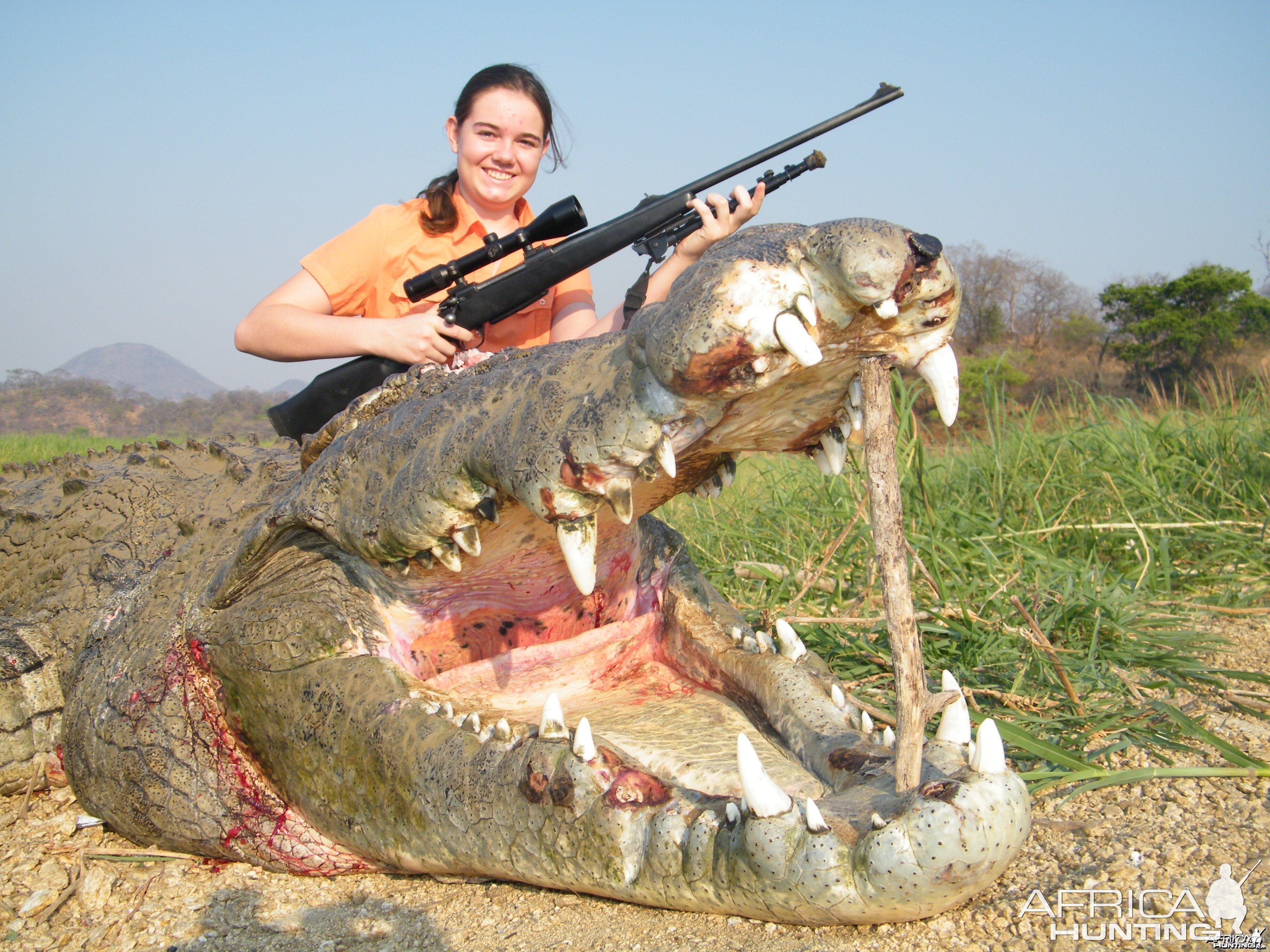 BIG crocodile with proud girl !