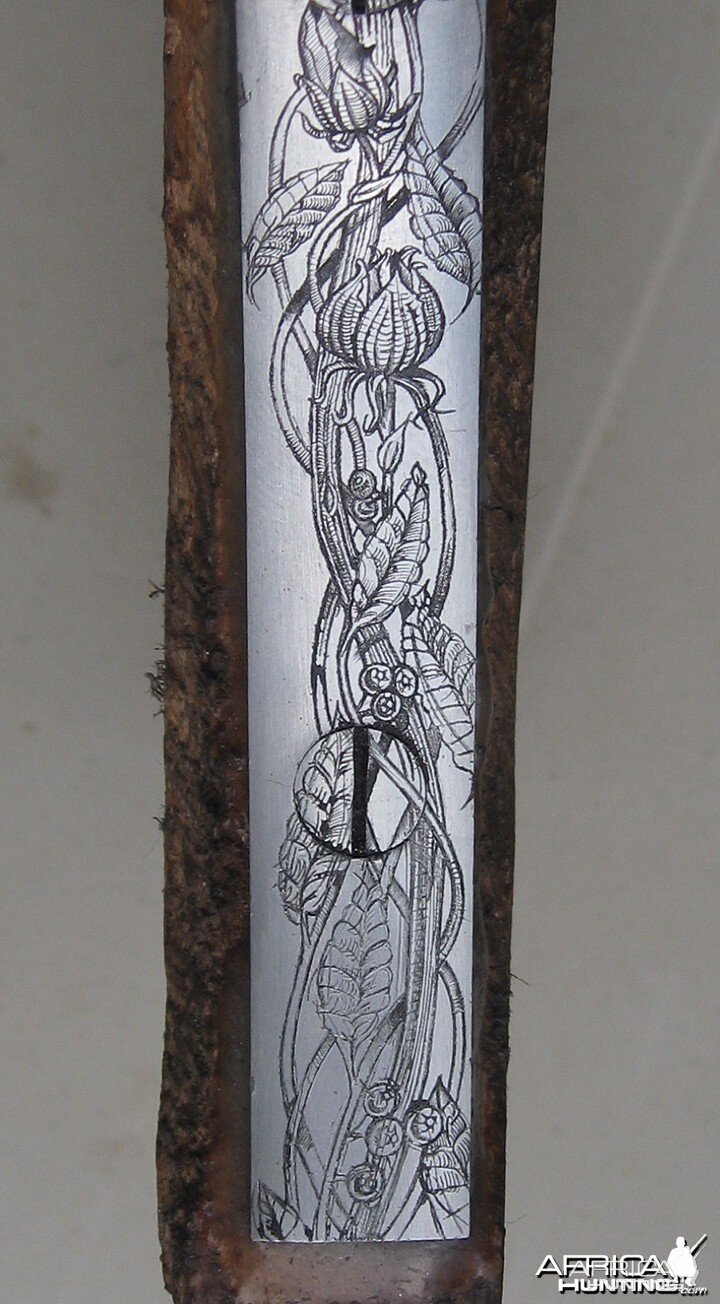 Engraved long trigger guard