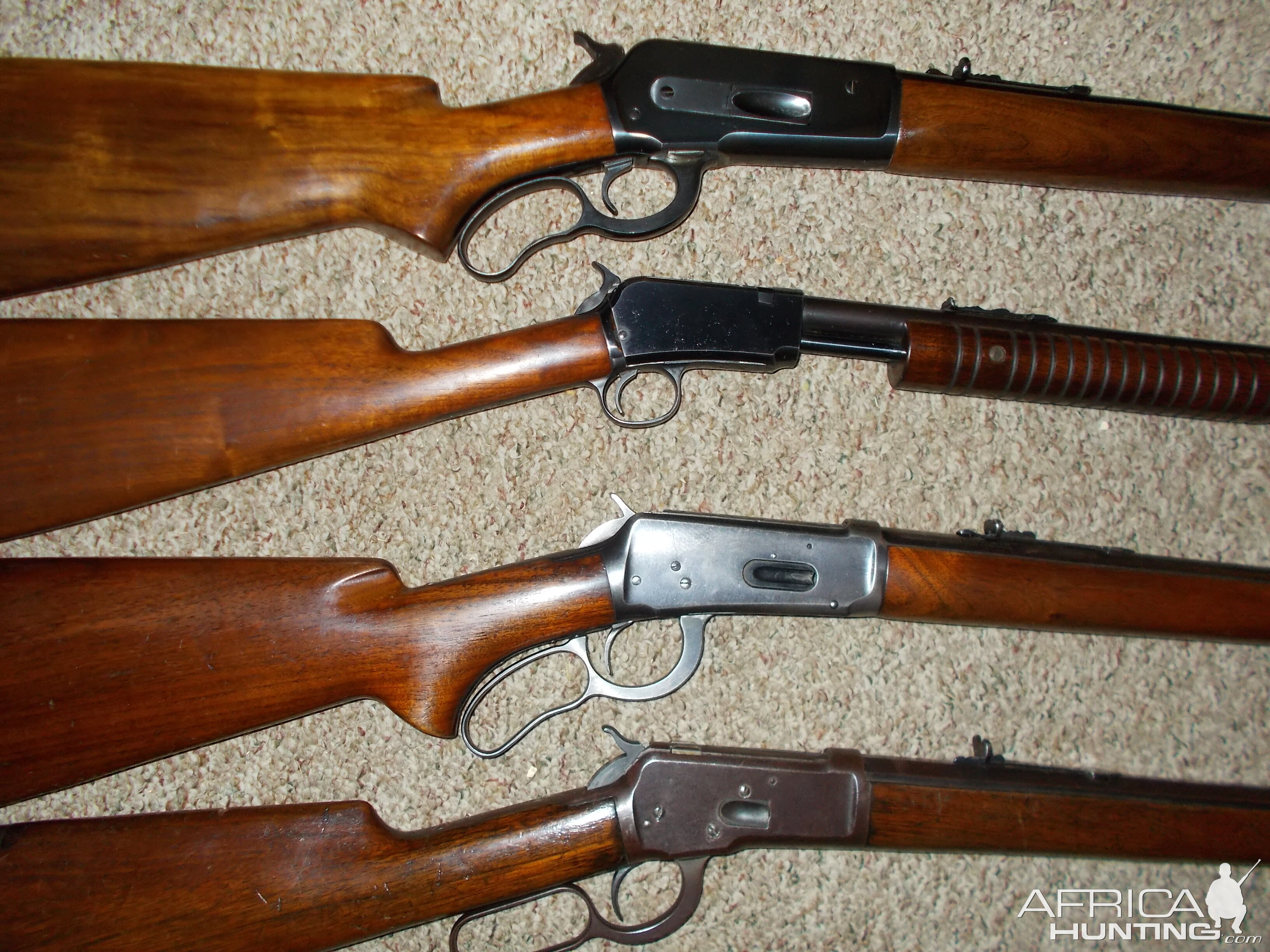 Four older Winchester rifles