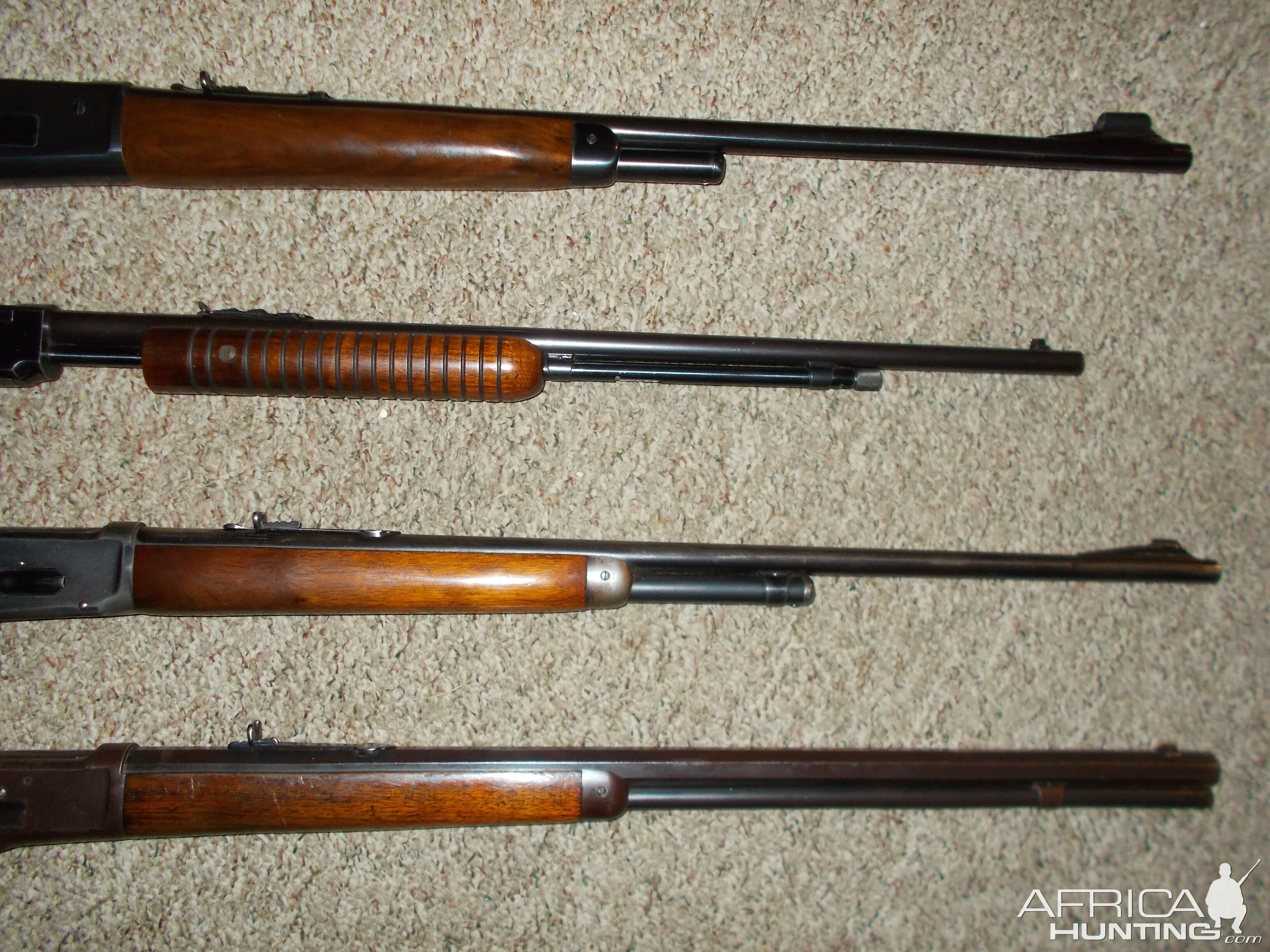 Four older Winchester rifles