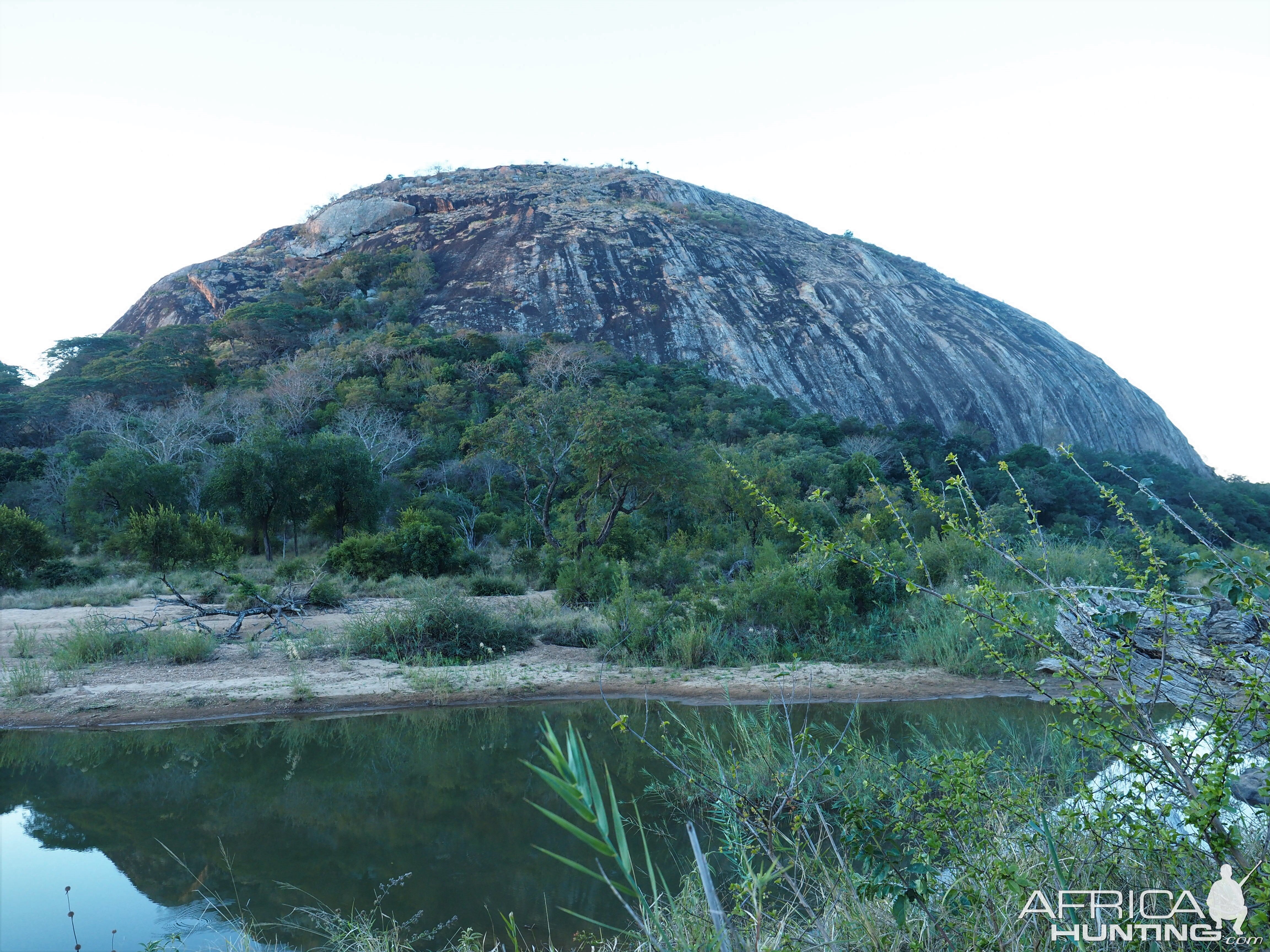 Gigantic rock and the river’s edge