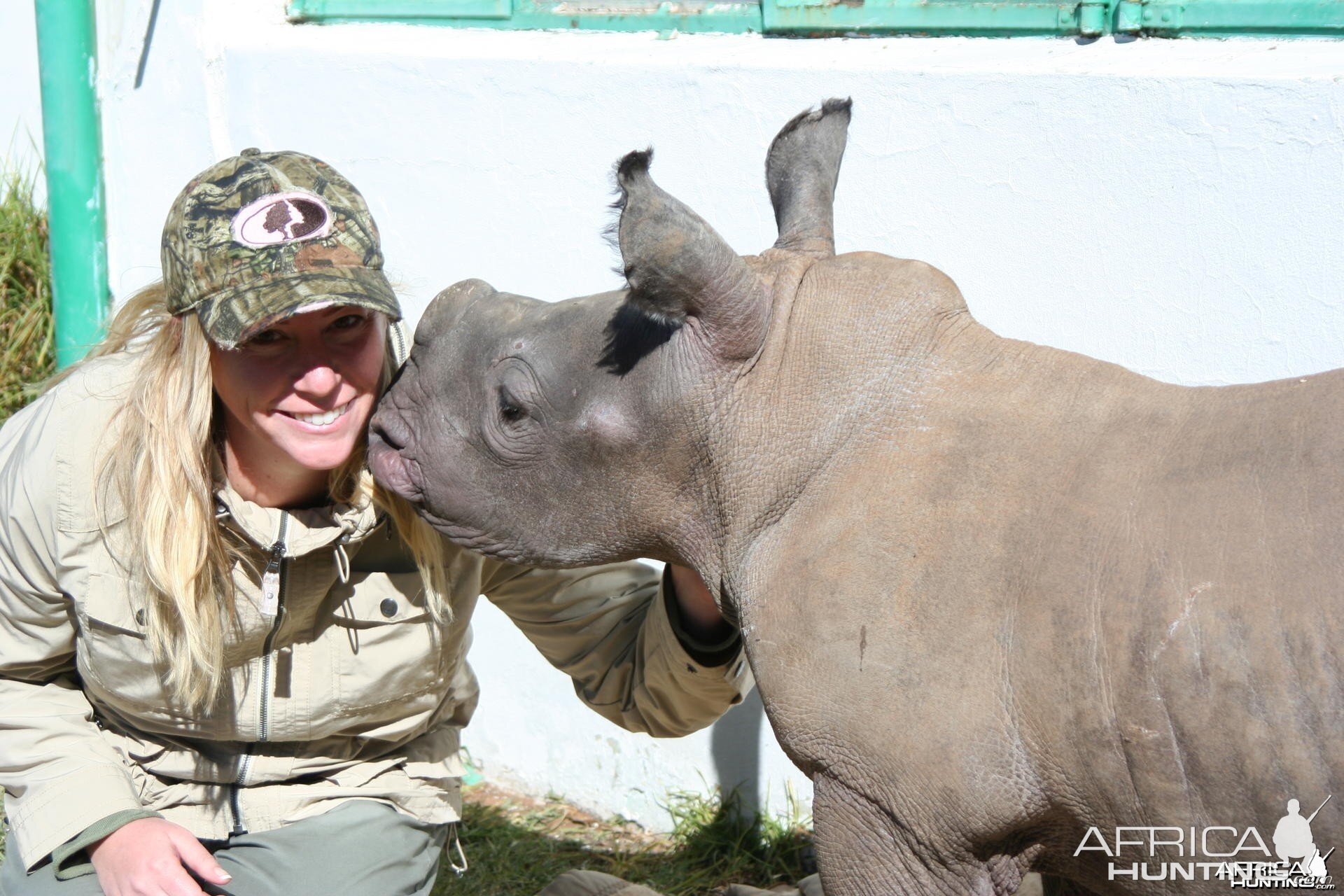 Here is a picture of my wife and the baby rhino on the farm