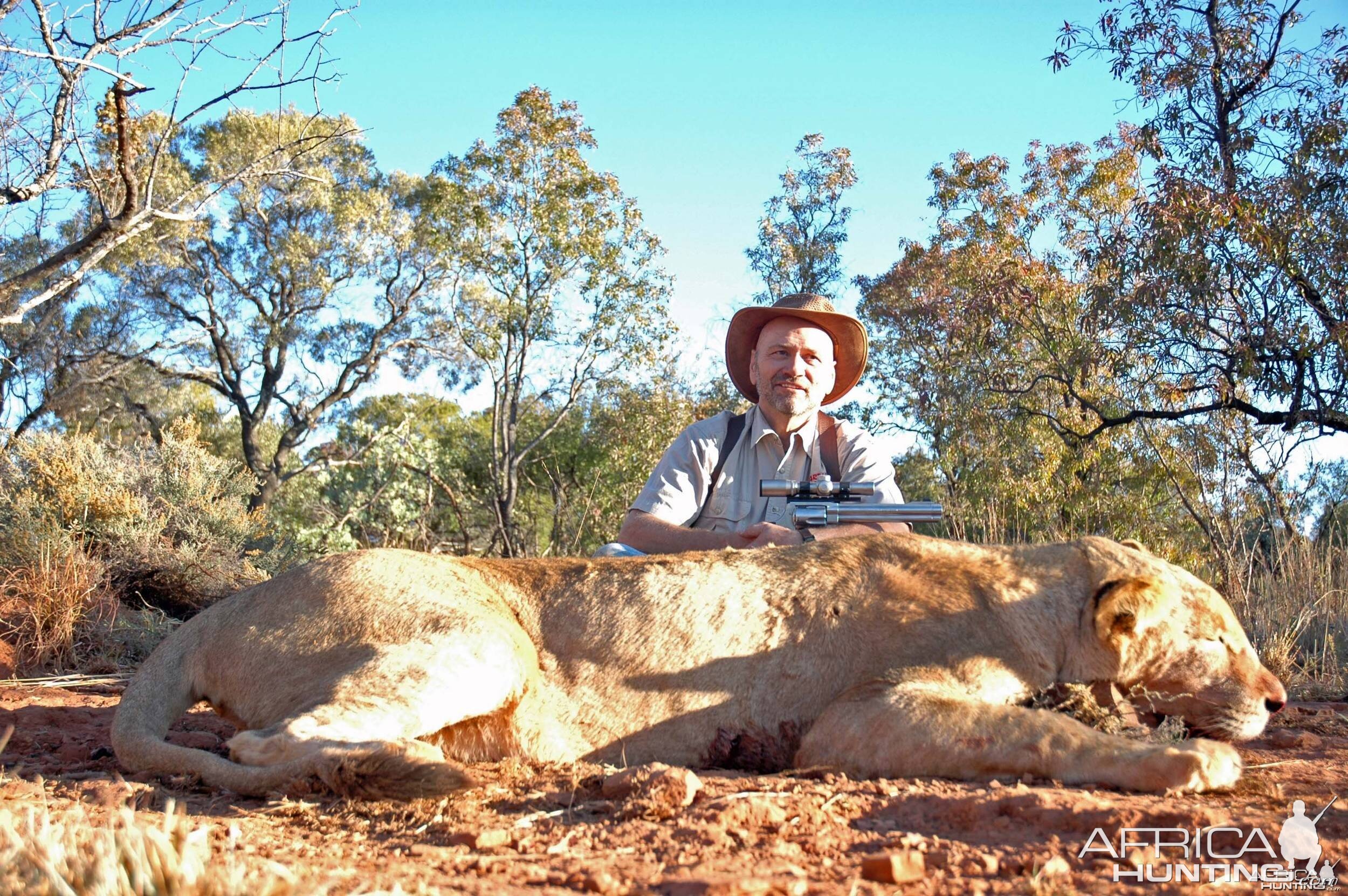Lion with 500 S&W revolver, took with Warthog Safaris
