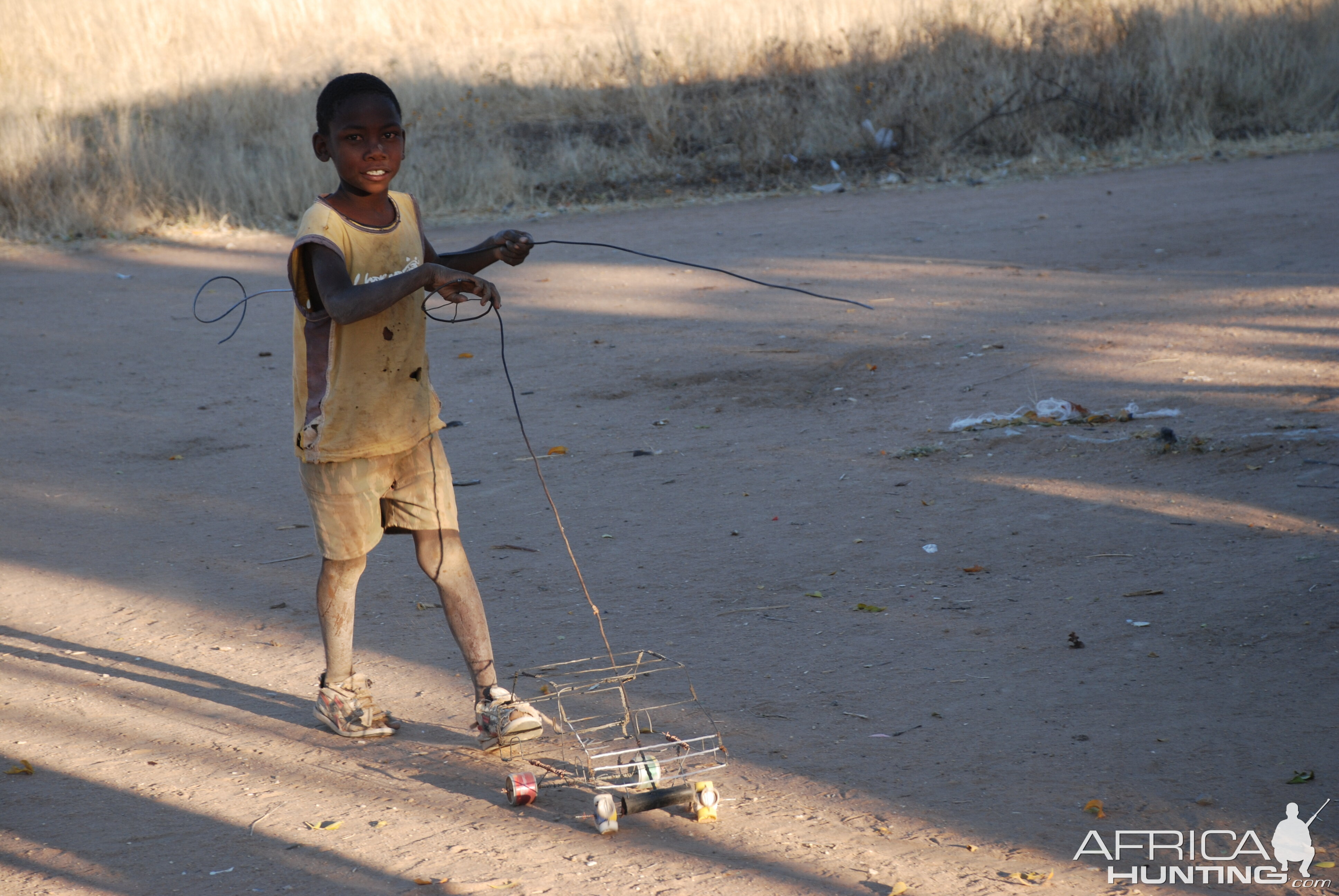 Little boy playing with his car, Namibia