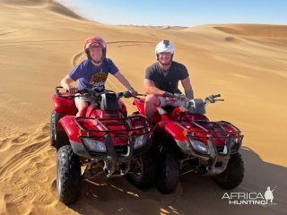 Quadbike Rides Coastal Area In Dunes Namibia