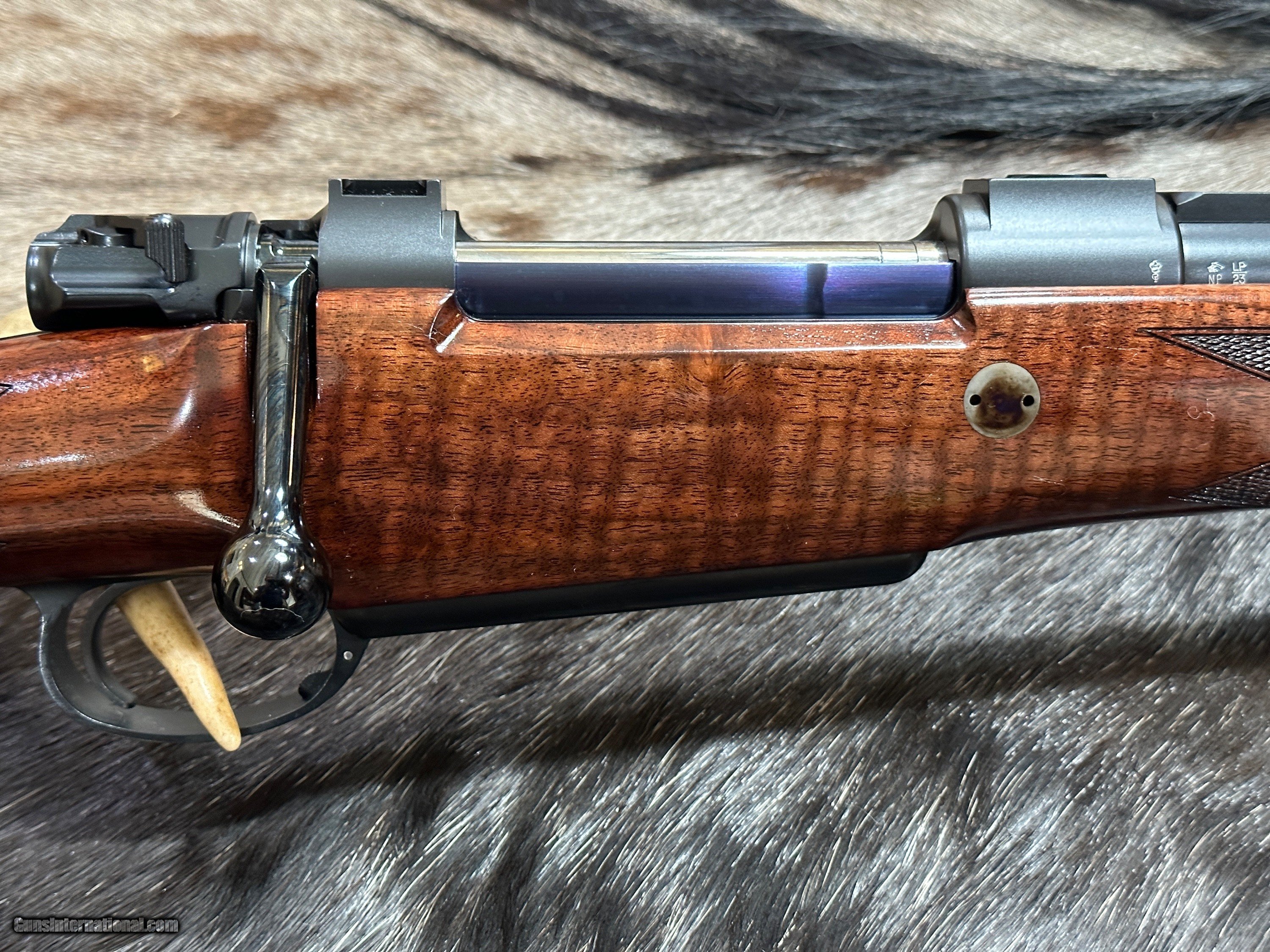 www.gunsinternational.com