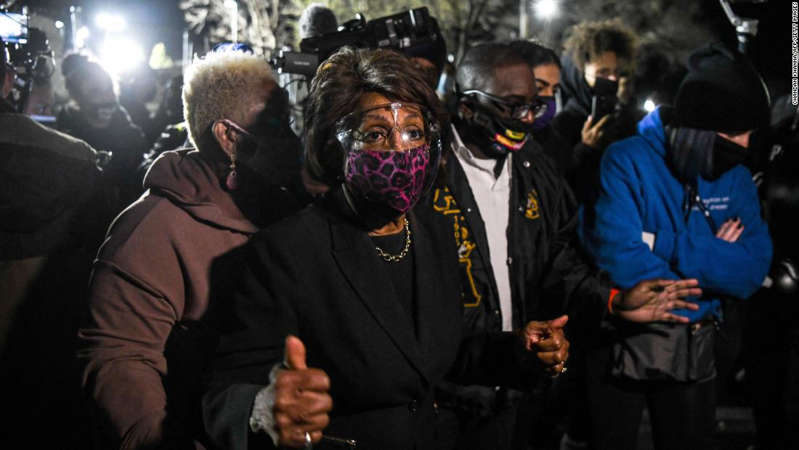 a group of people standing in front of a crowd: Representative Maxine Waters(C) (D-CA) speaks to the media during an ongoing protest at the Brooklyn Center Police Department in Brooklyn Centre, Minnesota on April 17, 2021.