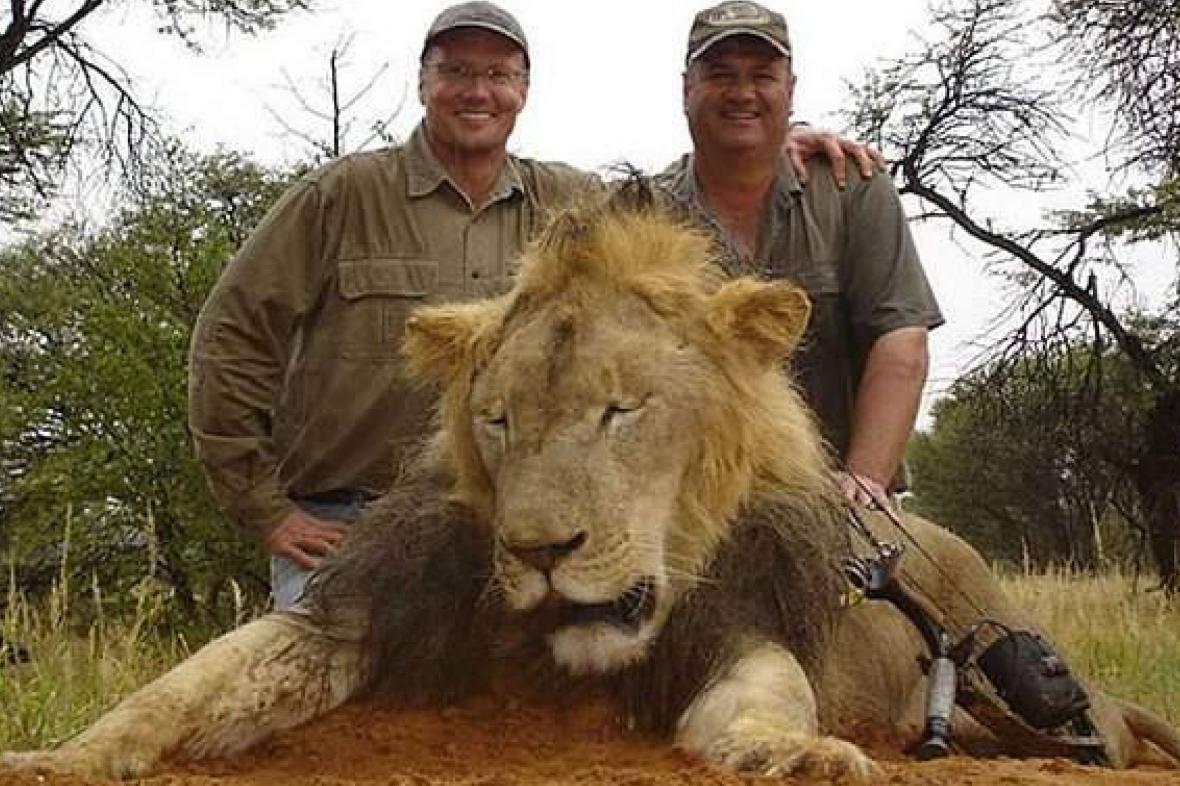 Walter Palmer, left, the dentist who killed Cecil the lion six years ago, poses with a kill in 2015